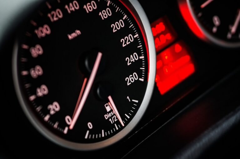 Detailed shot of a car's speedometer, highlighting the speed reading and dial design